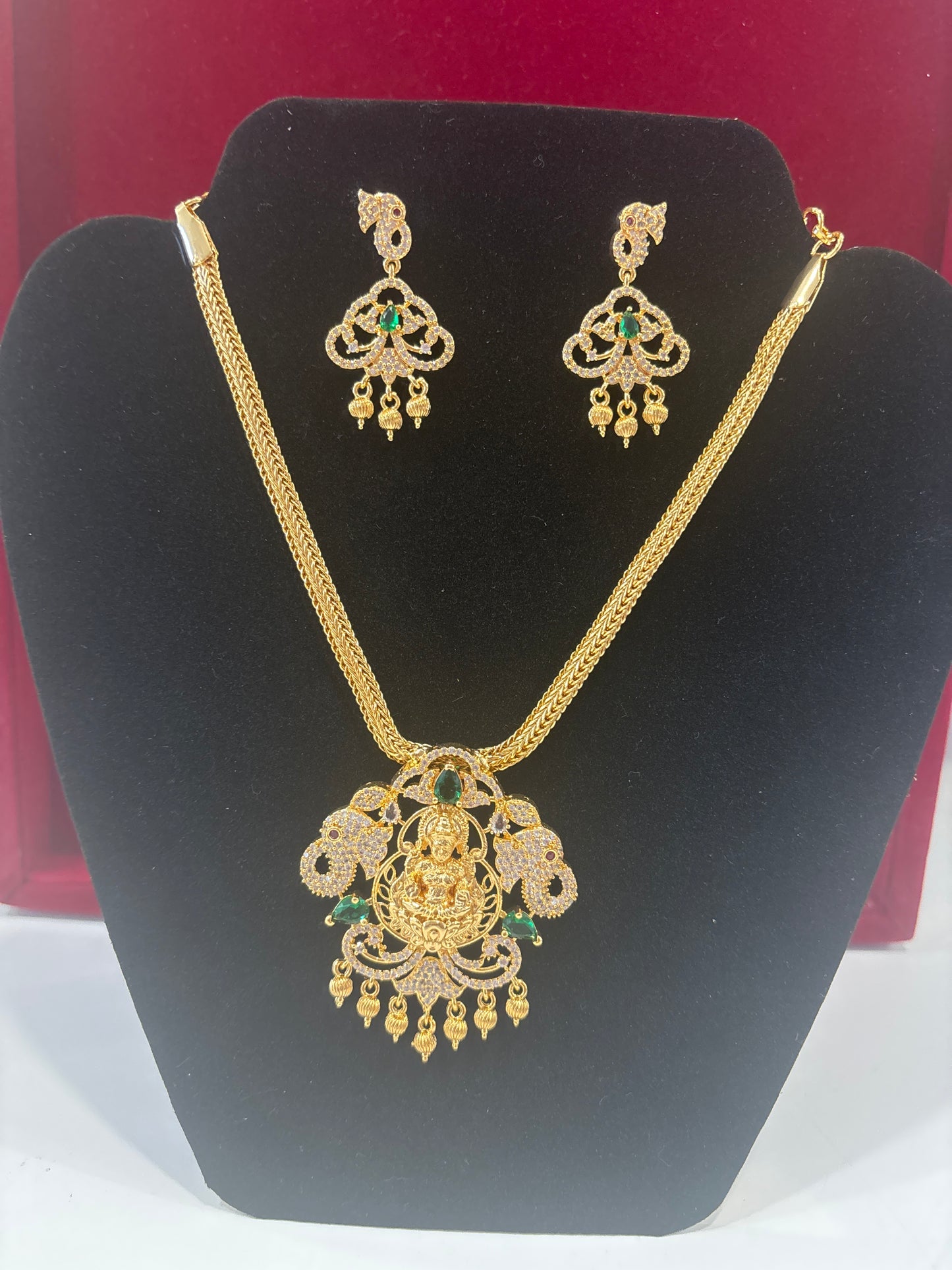 Alluring Green and White Stone Gold Plated Lakshmi locket Necklace Set For Women