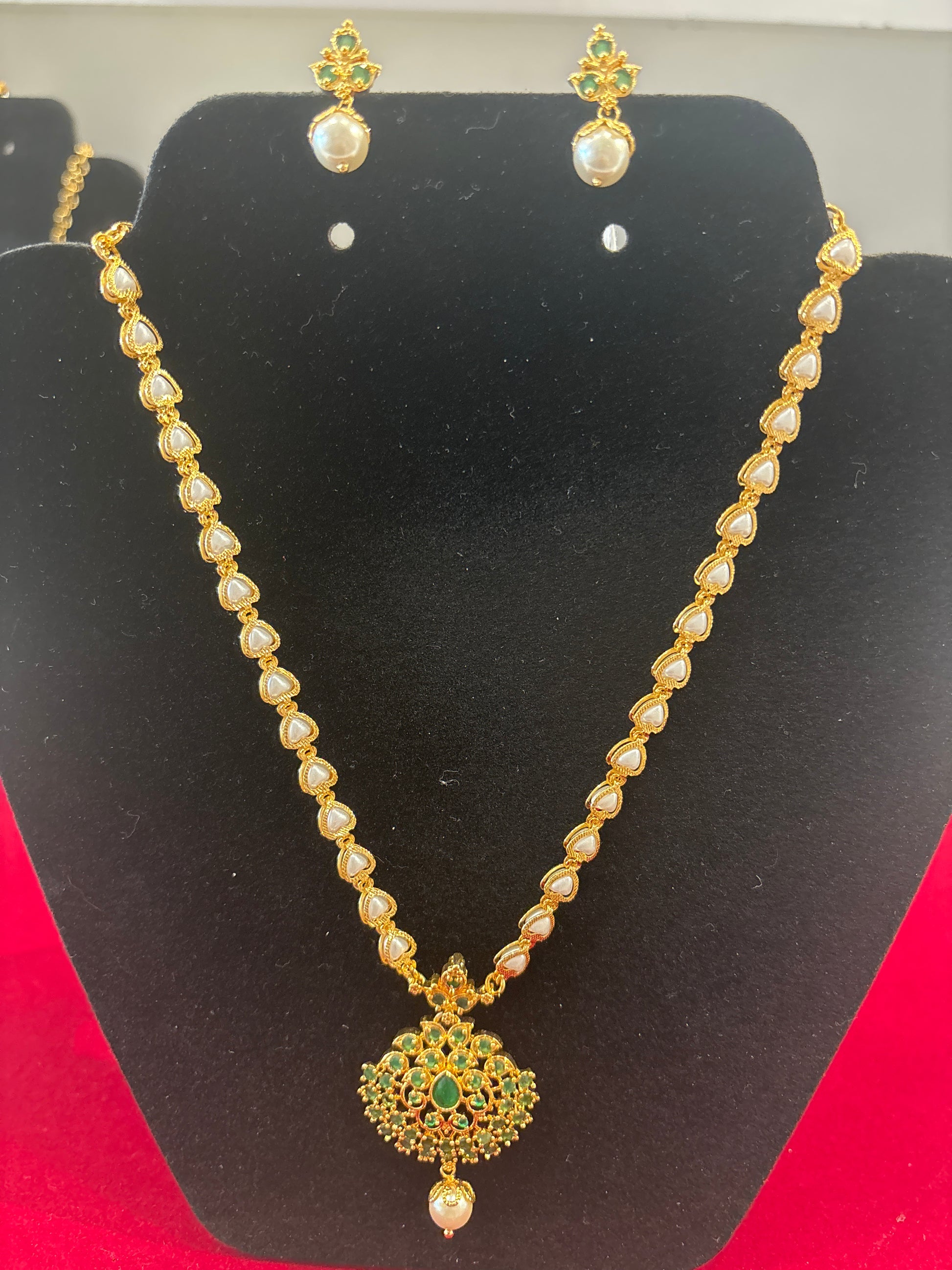 Appealing Green Color Stones And White Pearls Gold Plated Necklace With Earrings Set