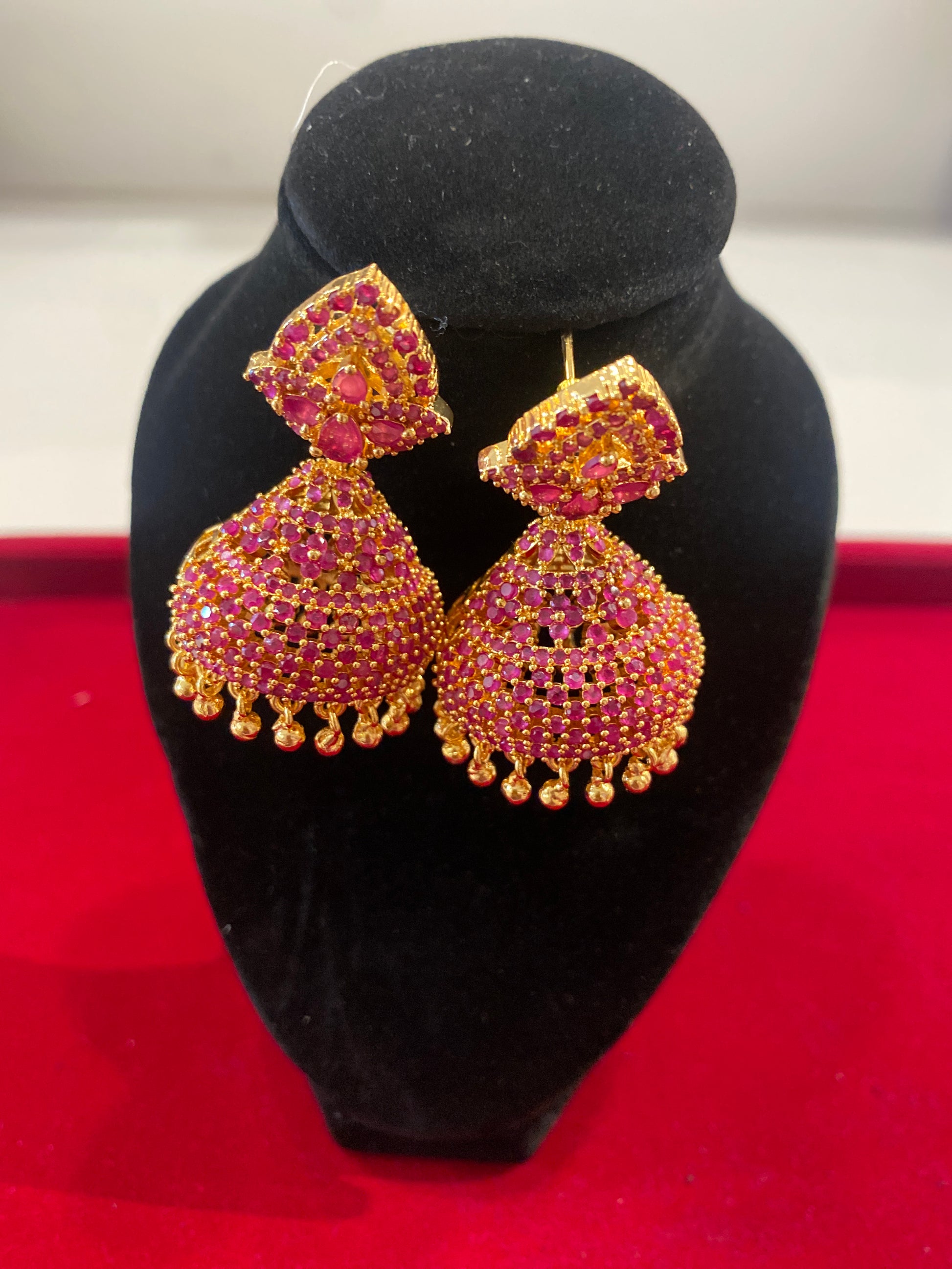 Gorgeous Red Stones Embadded Gold Plated Jhumkas For Women
