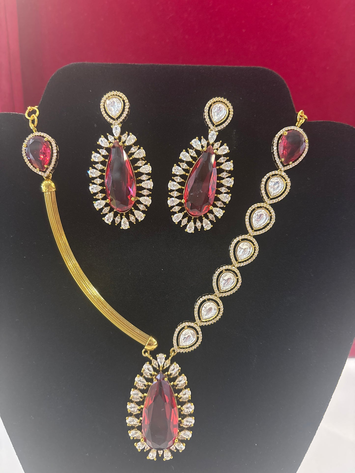Captivating Dark Red And White Stones Gold Plated Necklace With Earrings Set