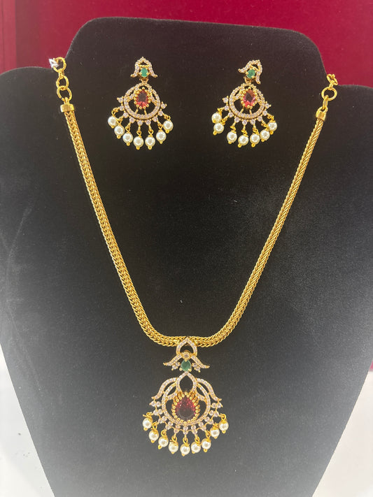 Alluring Red, Green And White Stones Gold Plated Pearls Hanging Necklace With Earrings Set