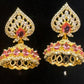 Pleasing Pink And White Stones Gold Plated Jhumkas