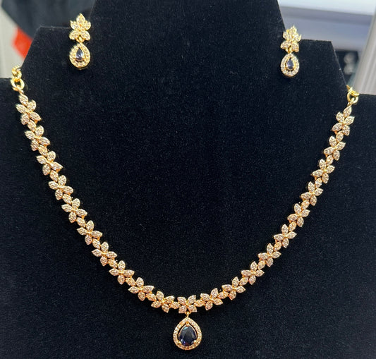 Fabulous Purple And White Colored Stone Gold Plated Necklace With Earrings Set