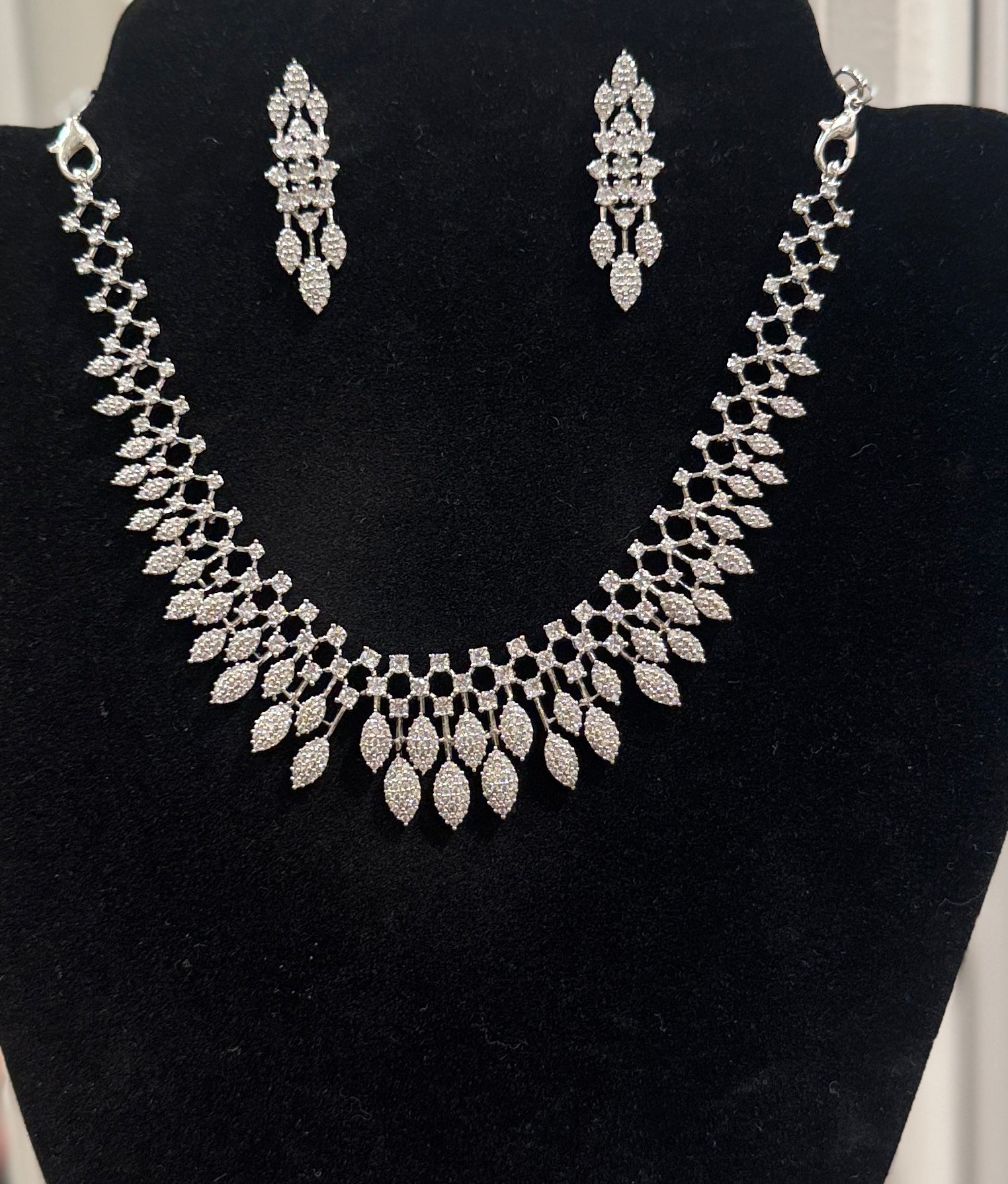 Pleasing Leaf Design American Diamond White Color Stones Necklace and Earrings Set