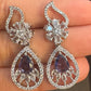 Dazzling White and Purple Stones Gold American Diamond Earrings