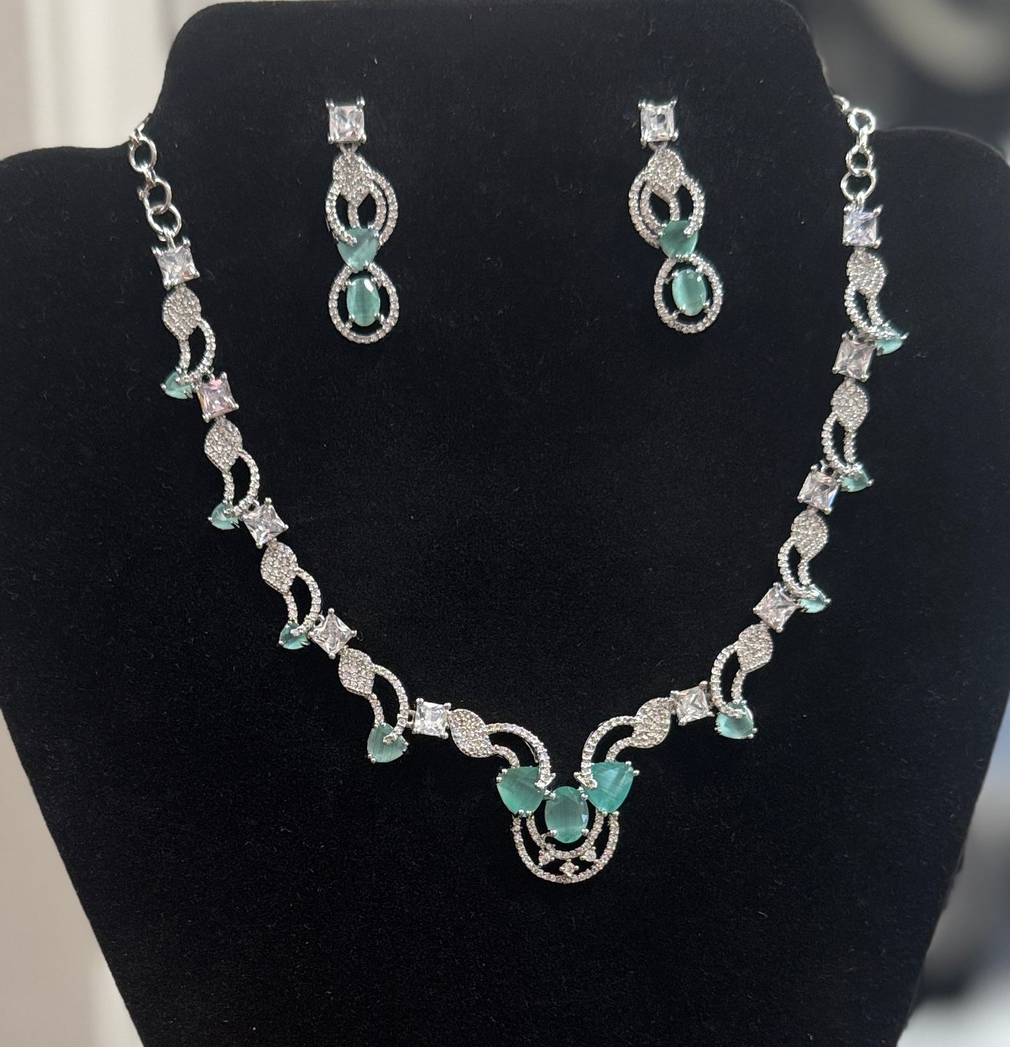 Alluring Blue And White Color Stones American Diamond Necklace With Earrings Set