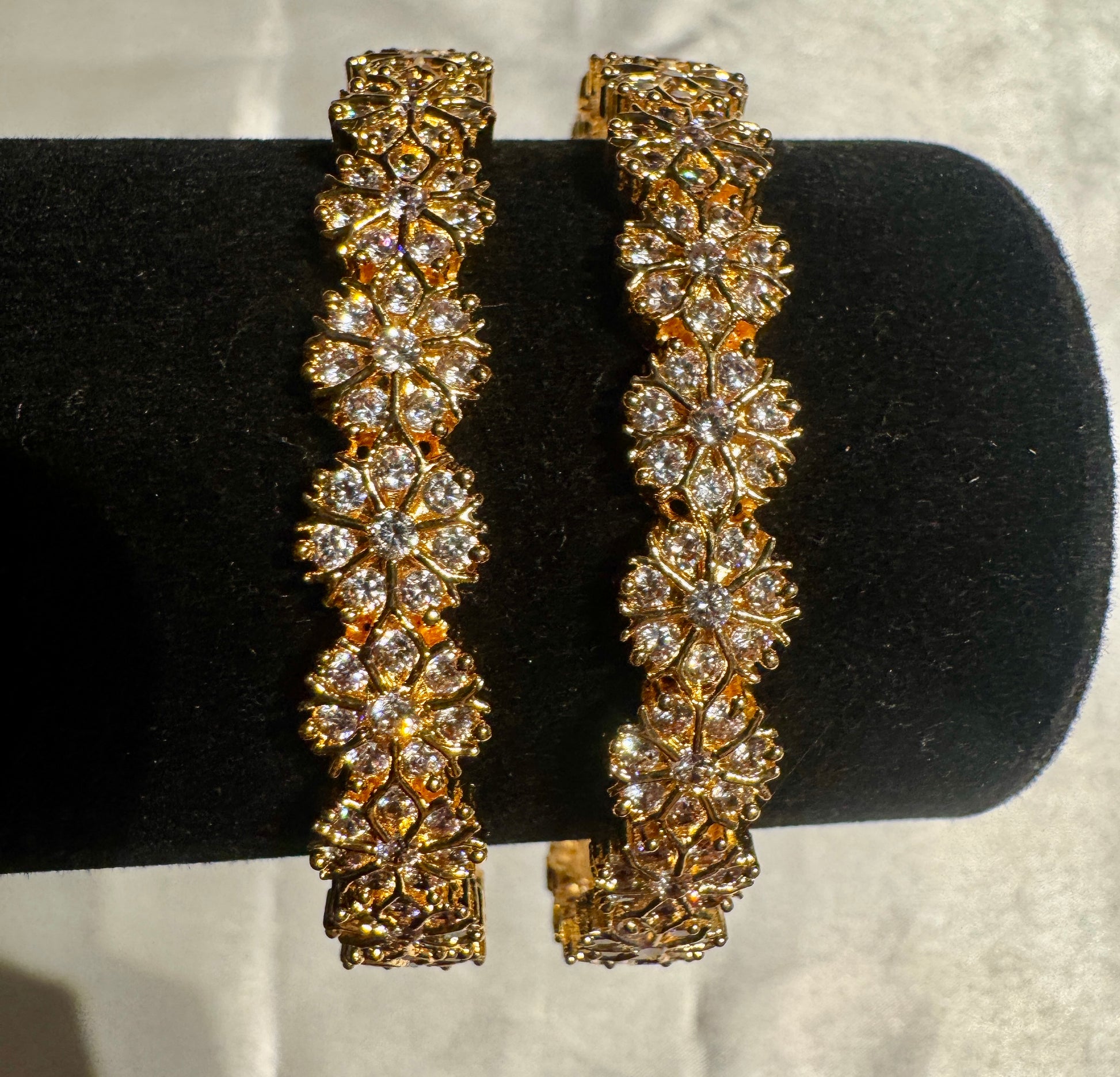 Elegant Gold Plated With Flower Design White Stones Embedded Bangles