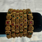 Alluring Antique Gold With Red And Green Stones Studded Bangles For Women
