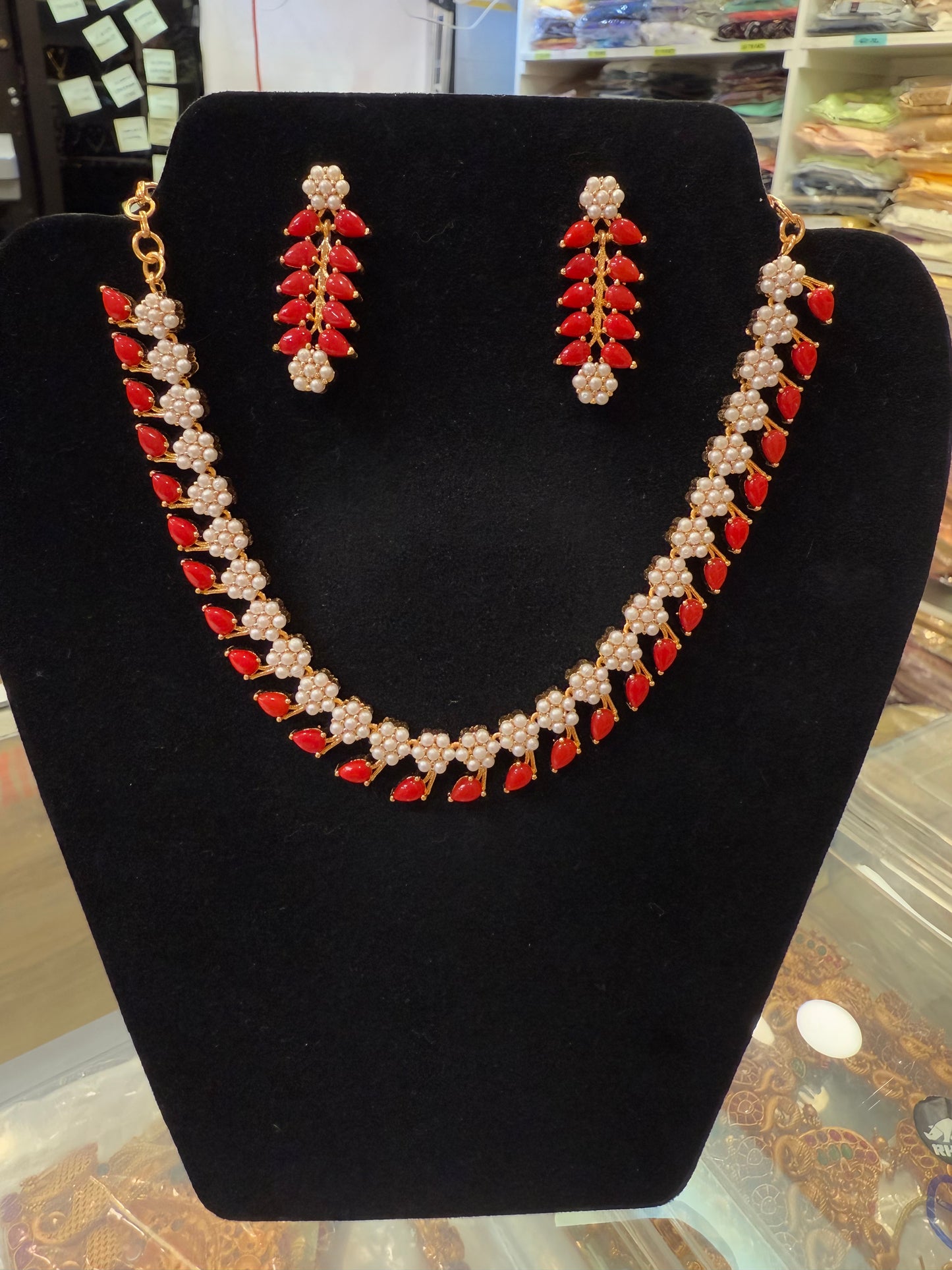 Alluring Gold Plated Red And White Color Stoned Leaf Design Necklace