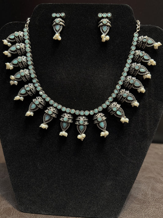 Alluring Emerald Stone Beaded German Silver Plated Oxidized Necklace Set With Earrings For Women