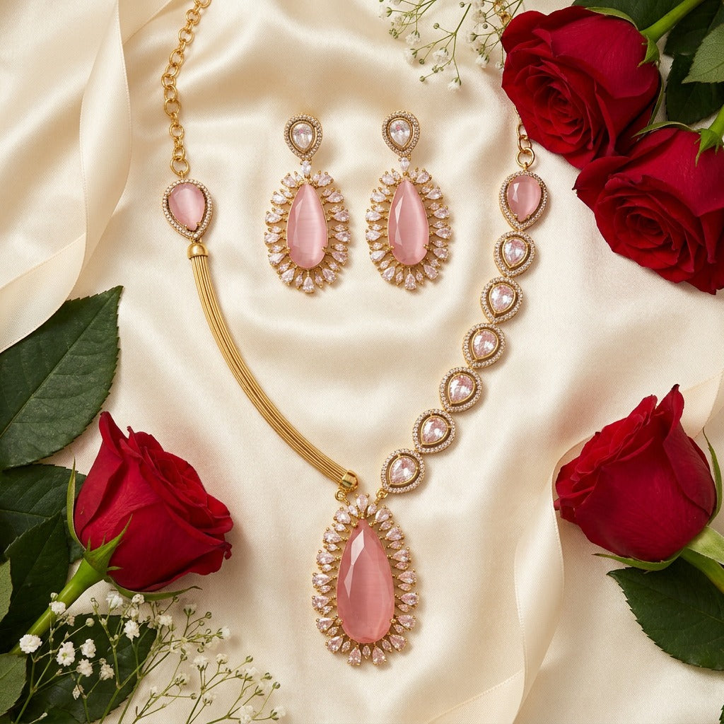 Fancy pink kundan and white stones gold plated jewelry set.