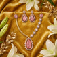 Fancy pink kundan and white stones gold plated jewelry set.