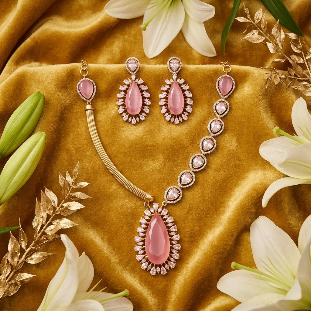 Fancy pink kundan and white stones gold plated jewelry set.