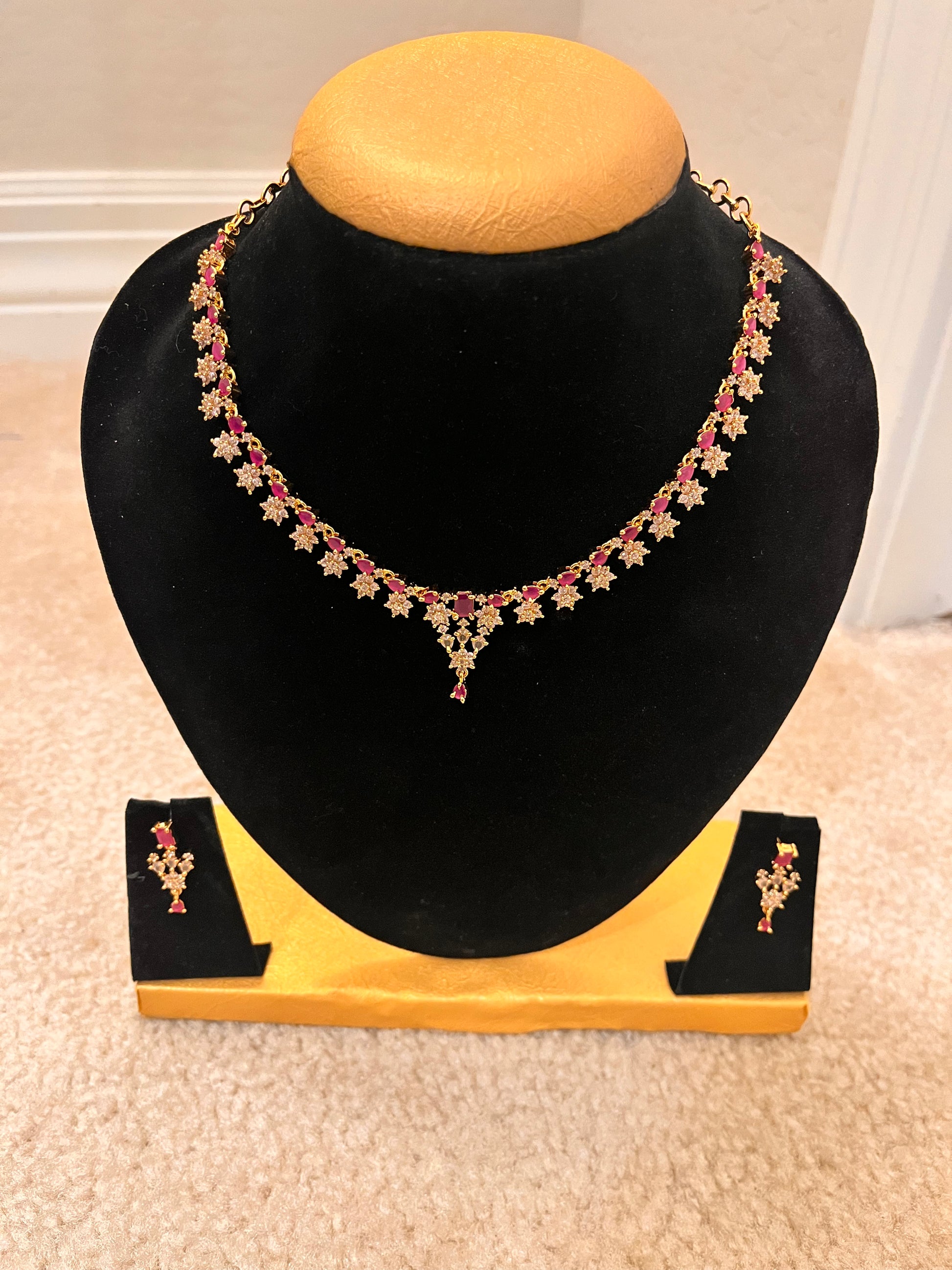 Attractive Gold Plated And Pink Stoned Necklace Set For Women