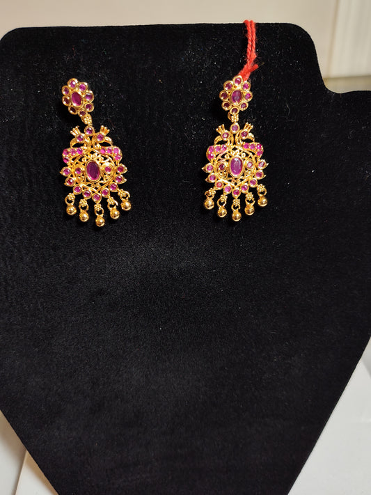 Pleasing Gold Plated Earrings With Red Stones