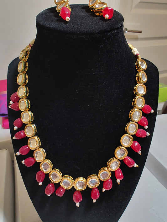 Elegant Kundan Necklace Set With Red Color Hangings 
