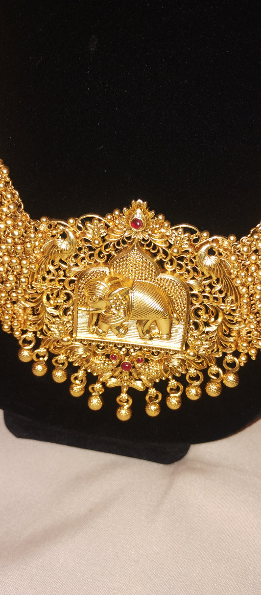 Matte finish gold plated peacock and elephant design temple style necklace and earrings