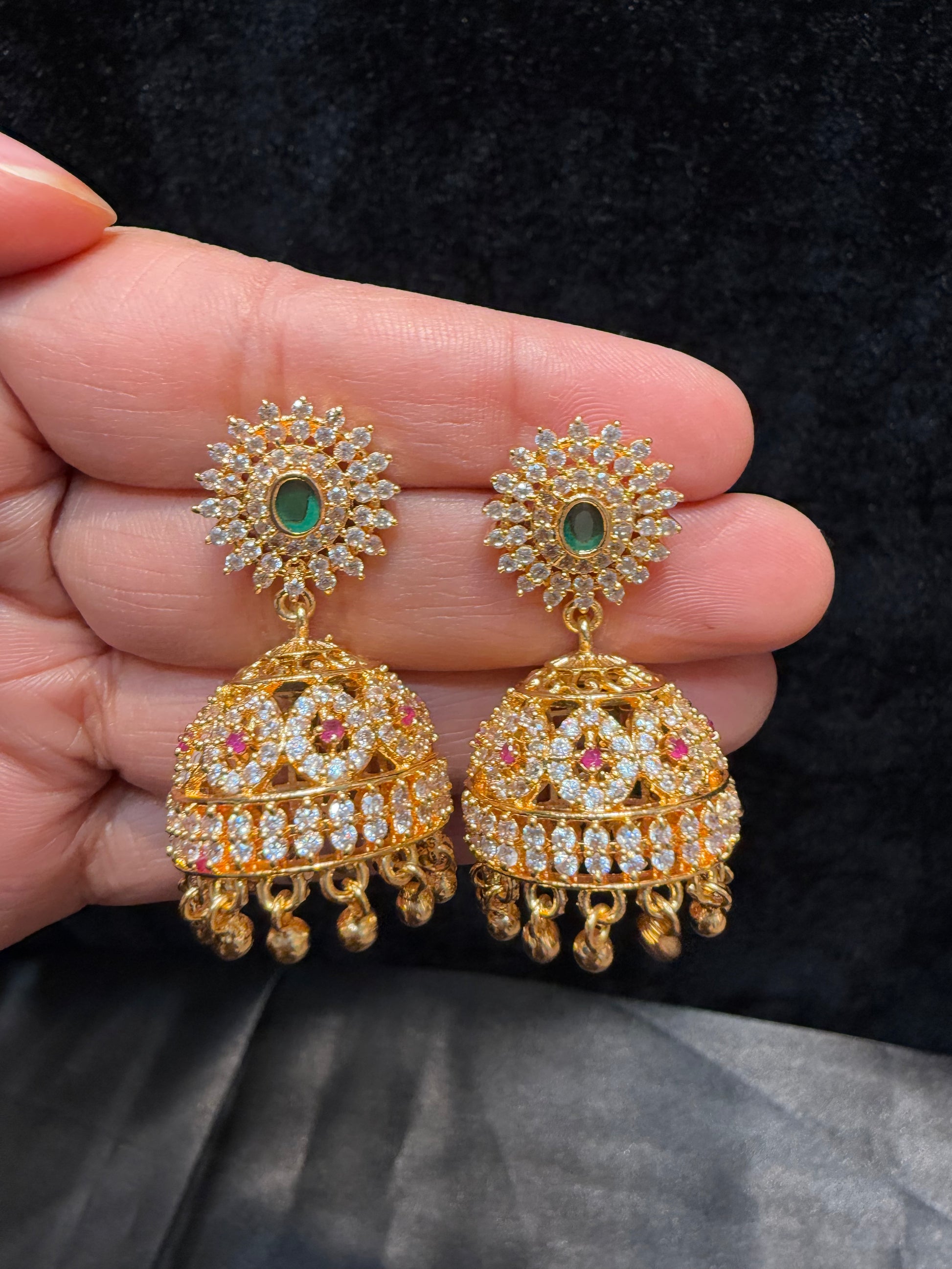 Attractive Gold Plated Designer Jhumka With Green Color Stone And Golden Beads