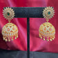 Appealing Gold Plated Designer Jhumka With Green Color Stone With Golden Beads