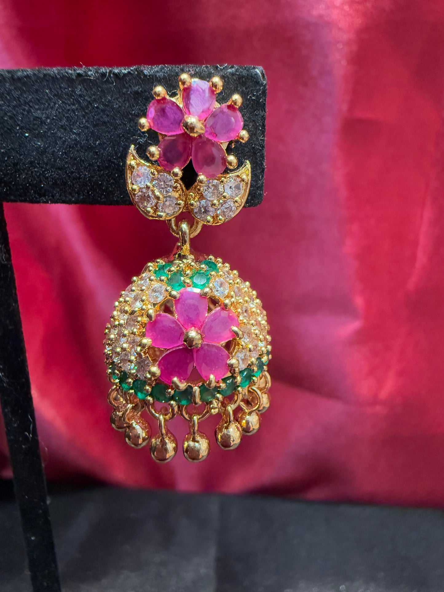 Dazzling Gold Plated Designer Jhumka with Hot Pink Color Stone And Golden Beads With Flower Designs