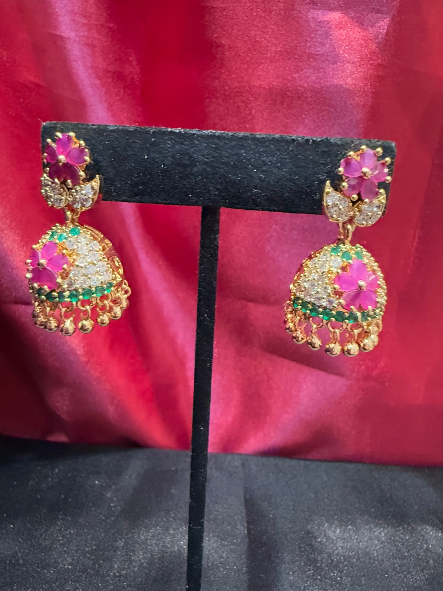 Dazzling Gold Plated Designer Jhumka with Hot Pink Color Stone And Golden Beads With Flower Designs