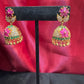 Dazzling Gold Plated Designer Jhumka with Hot Pink Color Stone And Golden Beads With Flower Designs