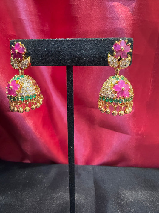 Dazzling Gold Plated Designer Jhumka with Hot Pink Color Stone And Golden Beads With Flower Designs