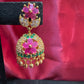 Dazzling Gold Plated Designer Jhumka with Hot Pink Color Stone And Golden Beads With Flower Designs