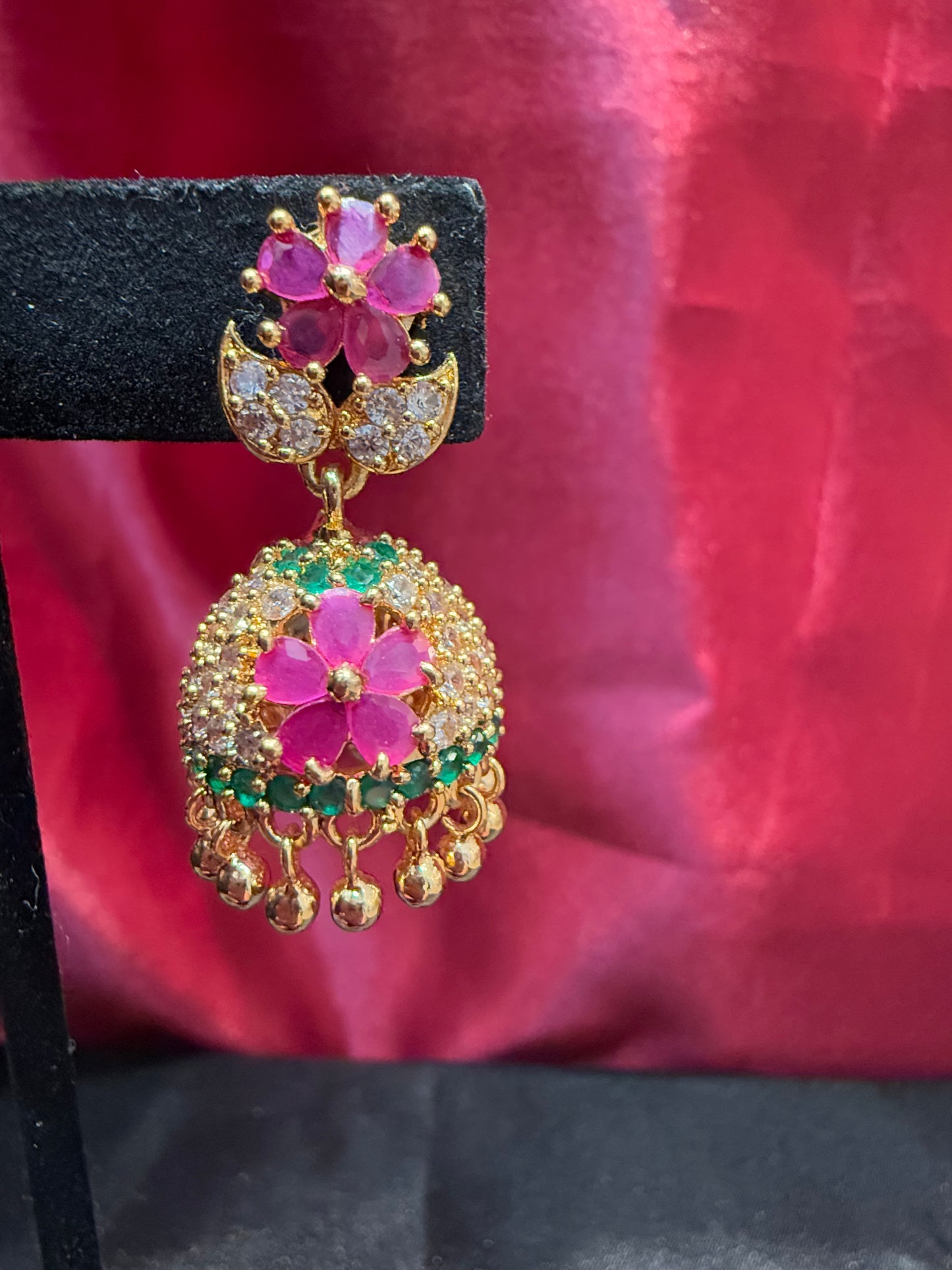 Dazzling Gold Plated Designer Jhumka with Hot Pink Color Stone And Golden Beads With Flower Designs