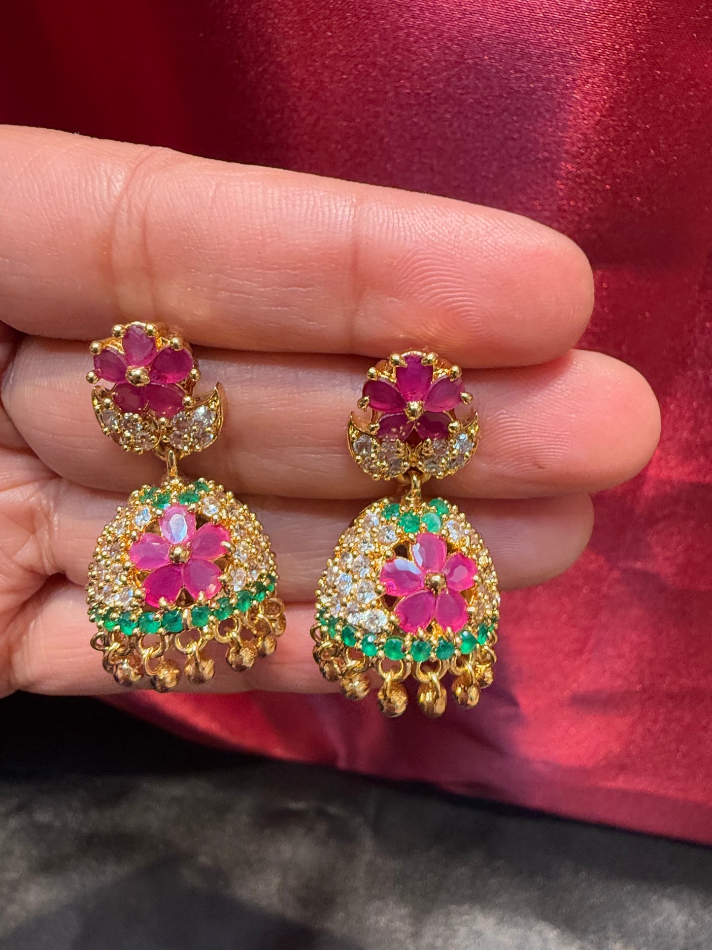 Dazzling Gold Plated Designer Jhumka with Hot Pink Color Stone And Golden Beads With Flower Designs