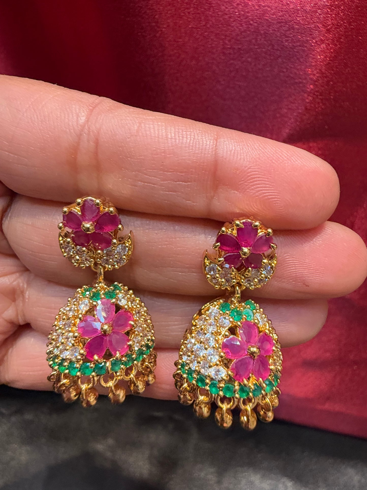 Dazzling Gold Plated Designer Jhumka with Hot Pink Color Stone And Golden Beads With Flower Designs