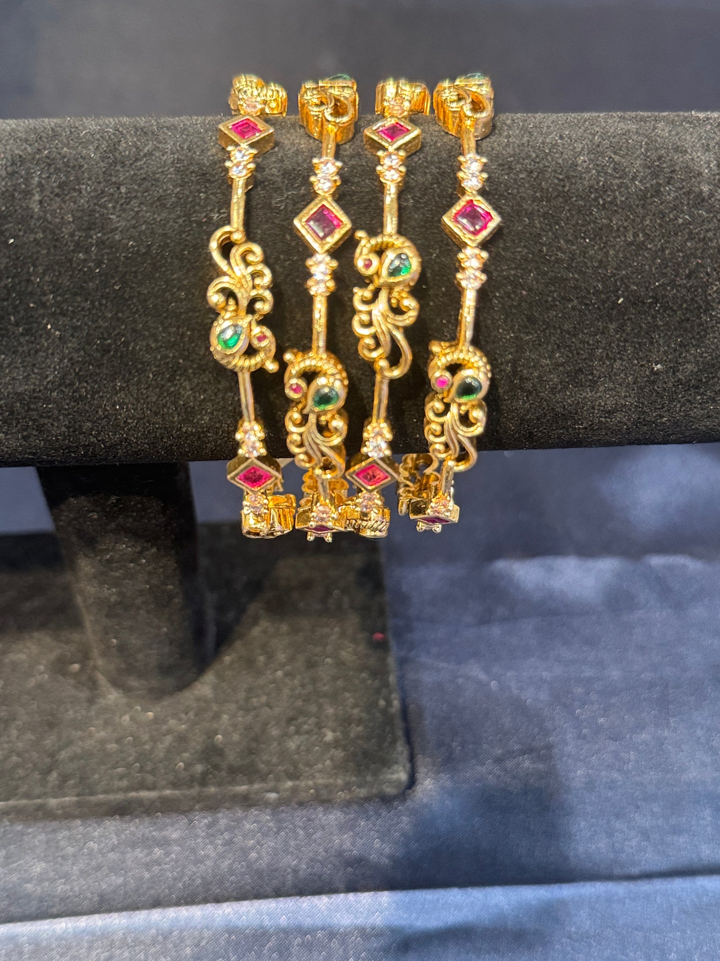 Appealing Red And Green Stones Gold Plated Bangles.