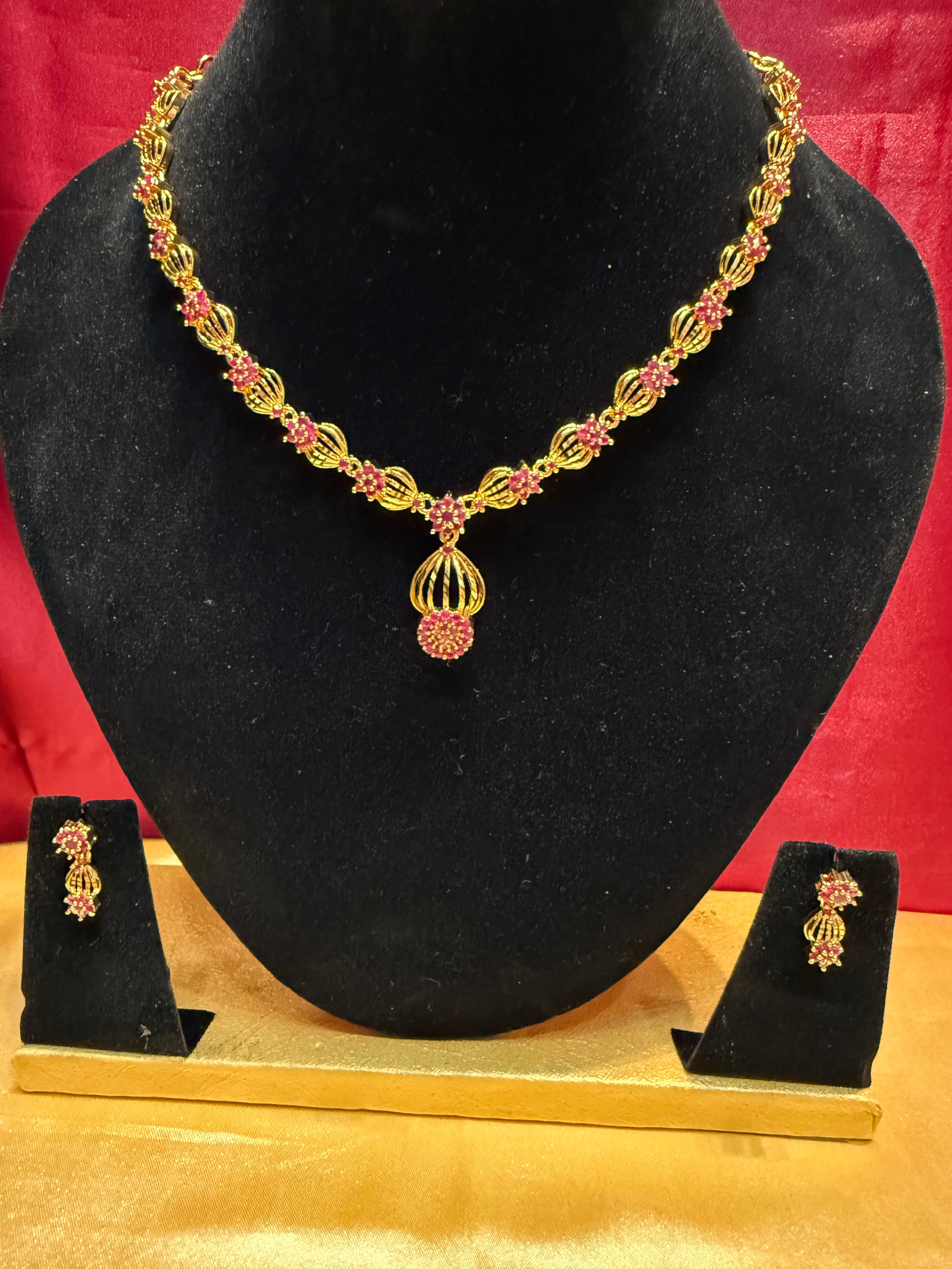 Fascinating Pink Color Stone Studded Gold Plated Necklace And Earrings Set