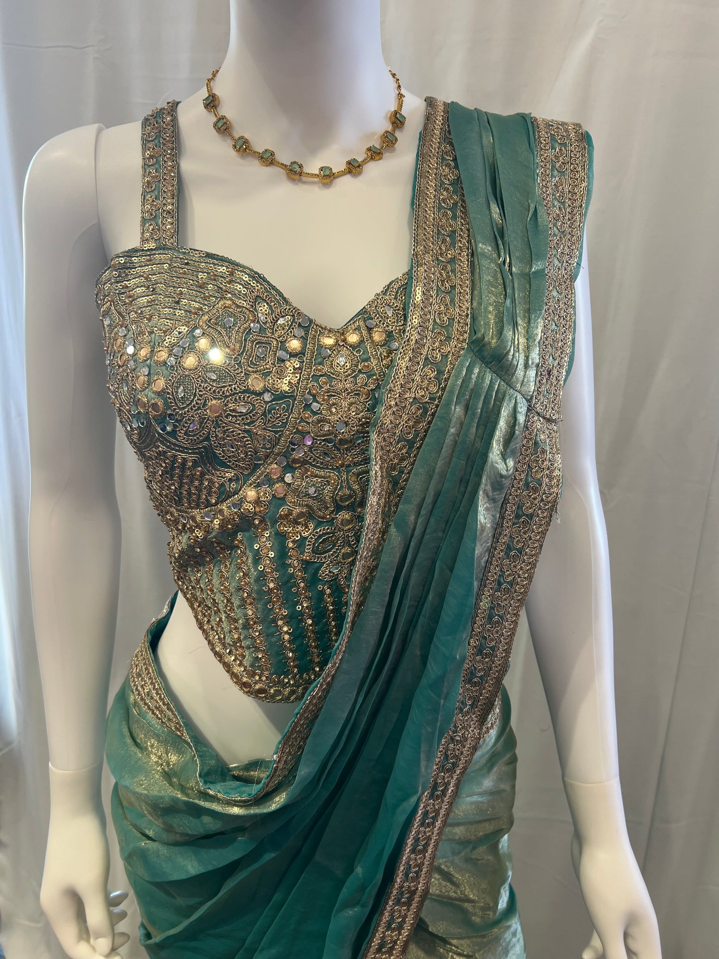 Attractive Teal Blue Color Tissue Silk Lehenga Choli With Embroidery And Sequins Work For Women