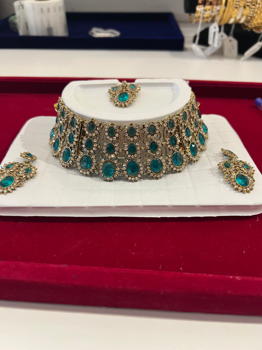 Attractive Light Green And Gold Stones American Diamond Choker With Maang Tikka And Earrings For Women