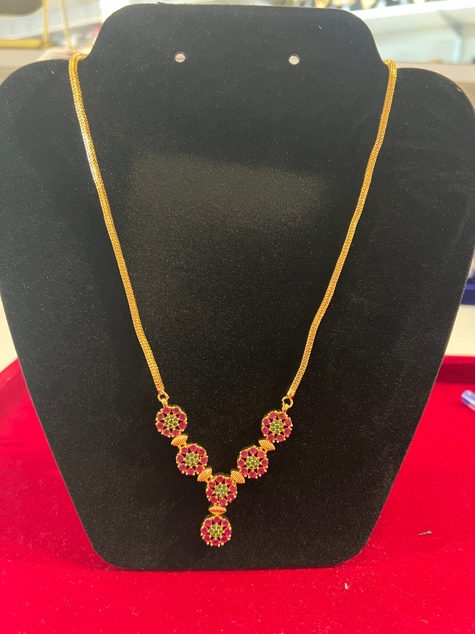 Appealing Red And Green Stones Gold Plated Necklace For Women