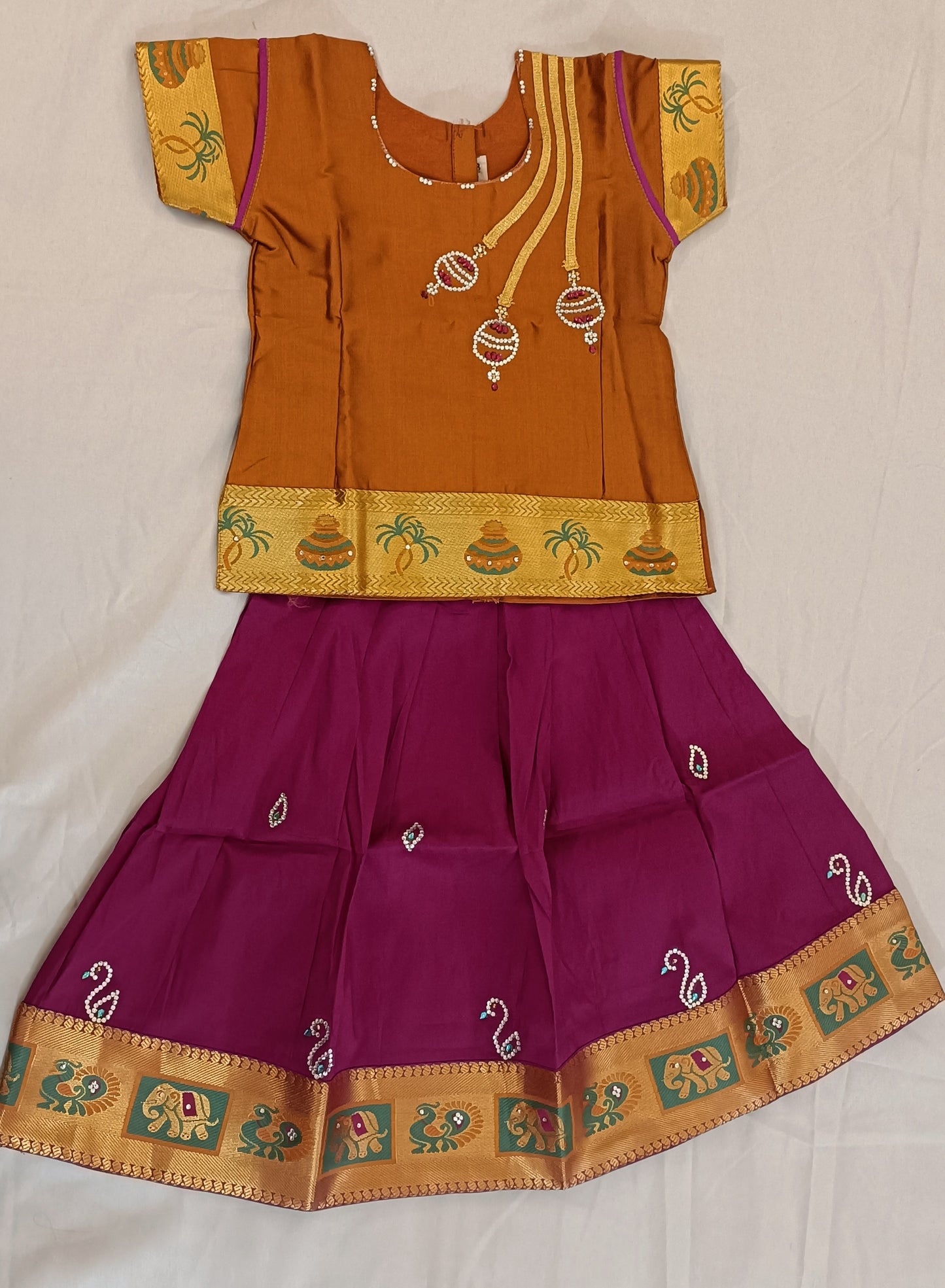 Fabulous Purple Color Embroidered And Stone Work Silk Langa Set