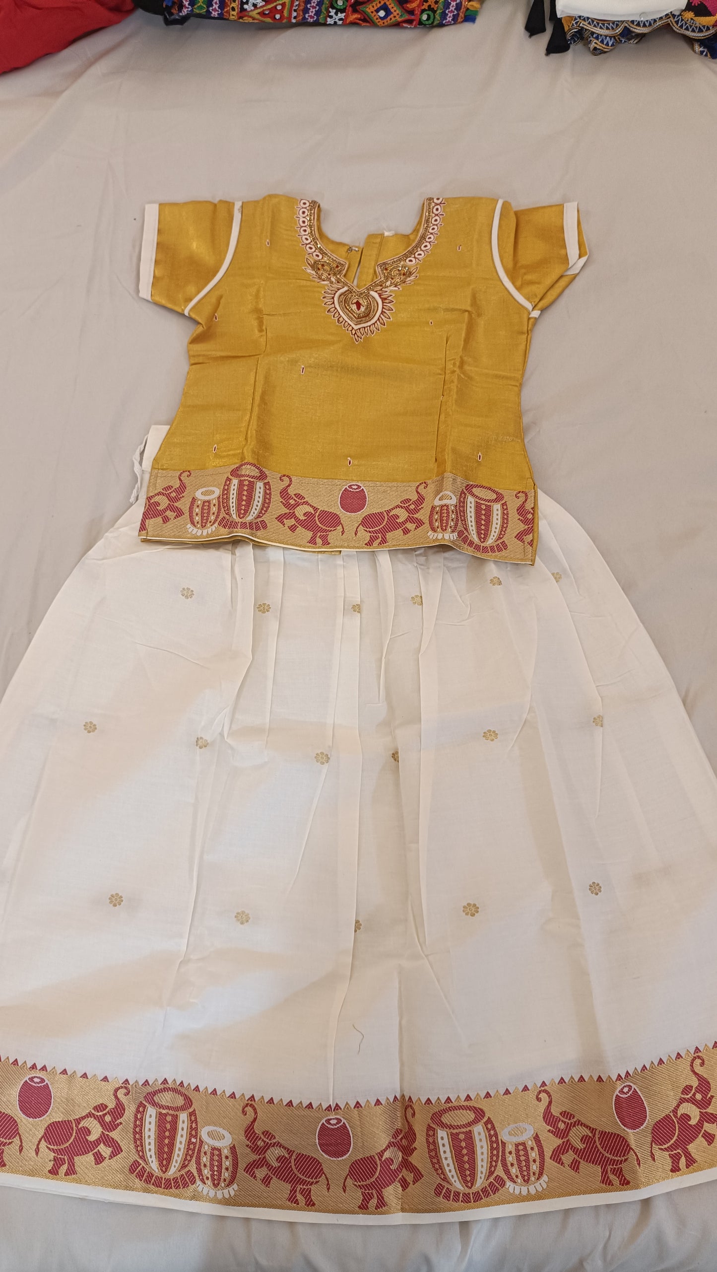 Gorgeous Yellow Color Embroidered And Stone Work Silk Langa Set