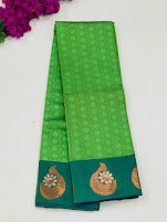 Alluring Green Embossed Art Silk Saree With Butta motifs And Contrast Pallu 