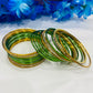 Shimmering Graceful Green Color Stone Studded Designer Metal Bangle Sets