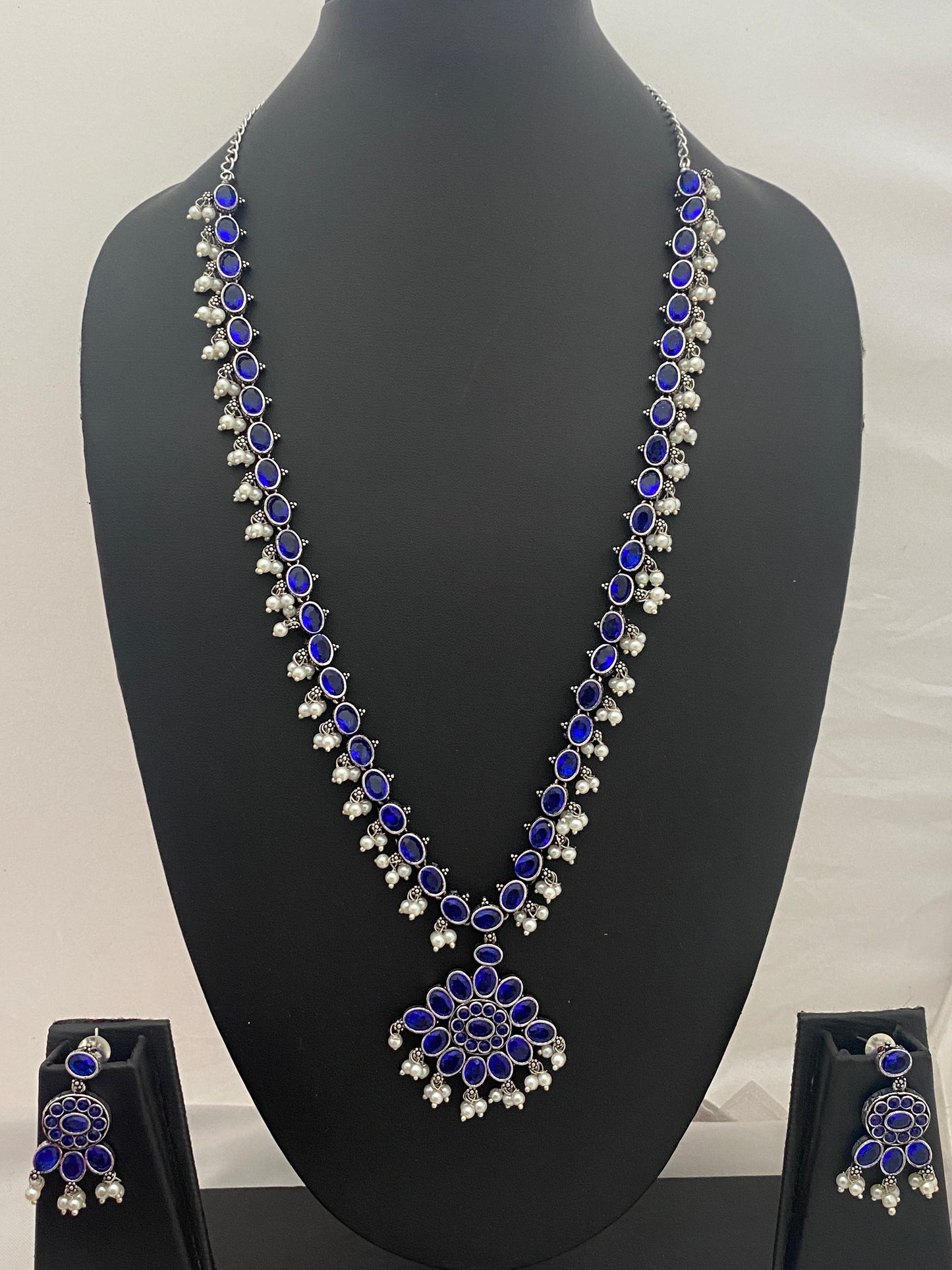 Dazzling Blue Color Silver Toned Oxidized Kundan Style Long Chain With Earrings And pearl Beads