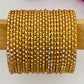 Stunning Designer Yellow Color Metal Bangle Set With Glitters