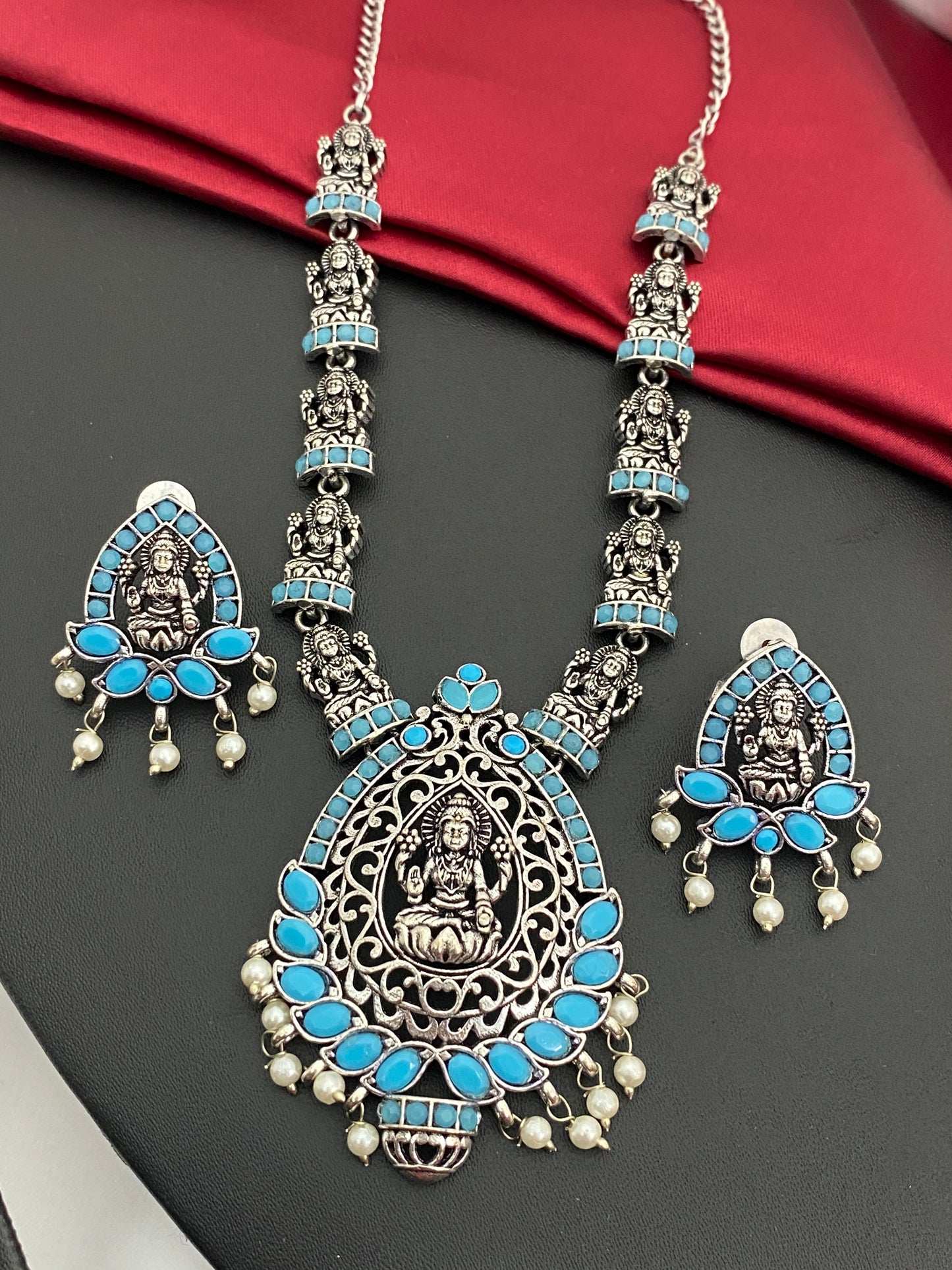 Sizzling Blue Stone Studded Lakshmi Pendant Temple Jewelry Necklace Set With Earrings