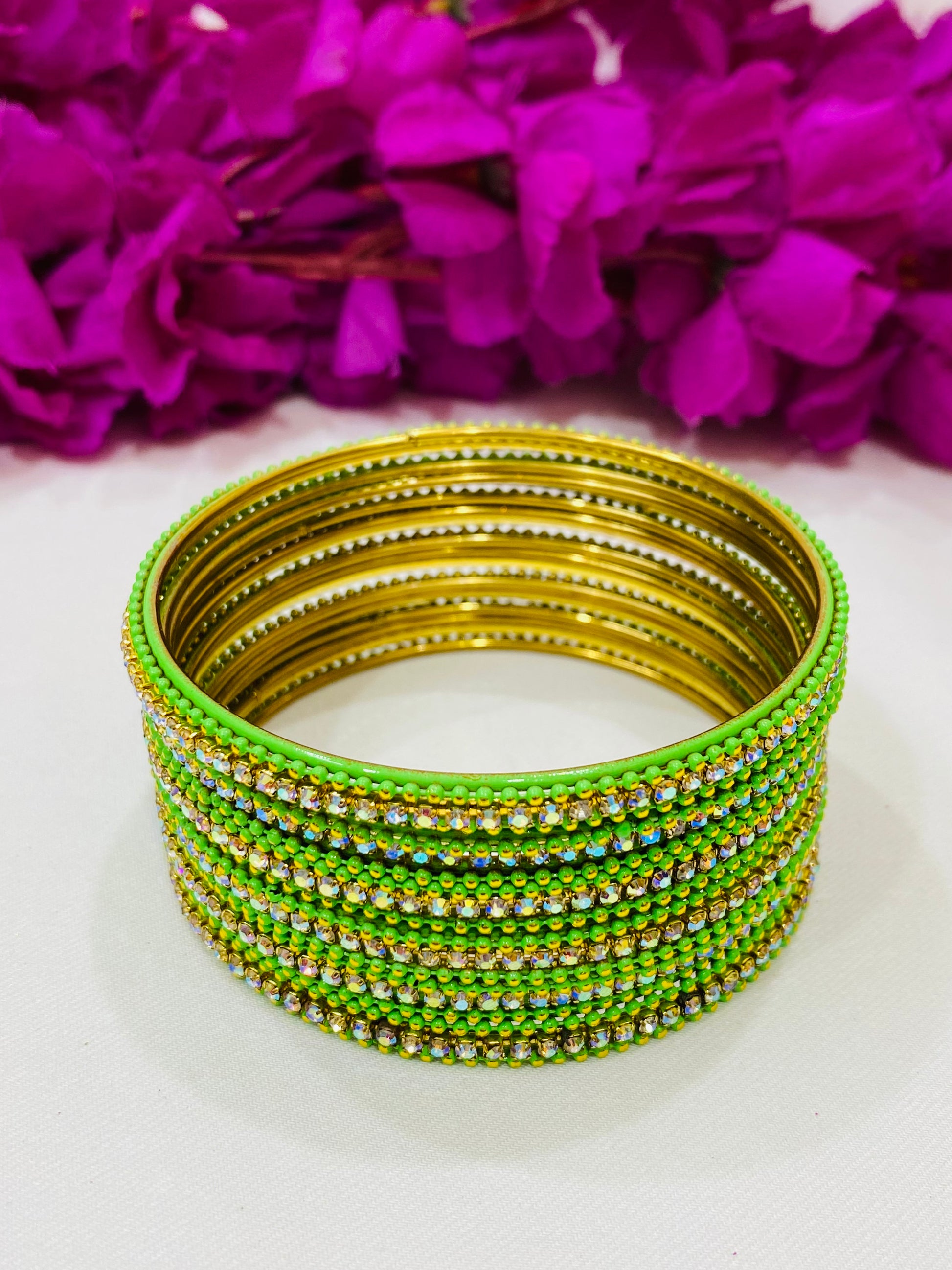 Pleasing Light Green Color Metal Bangles With Glittering Stones For Women