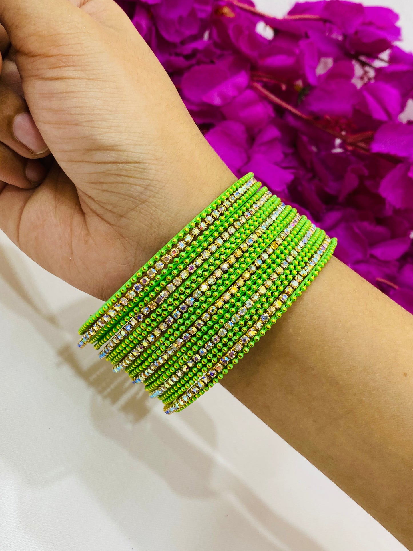 Pleasing Light Green Color Metal Bangles With Glittering Stones In Surprise