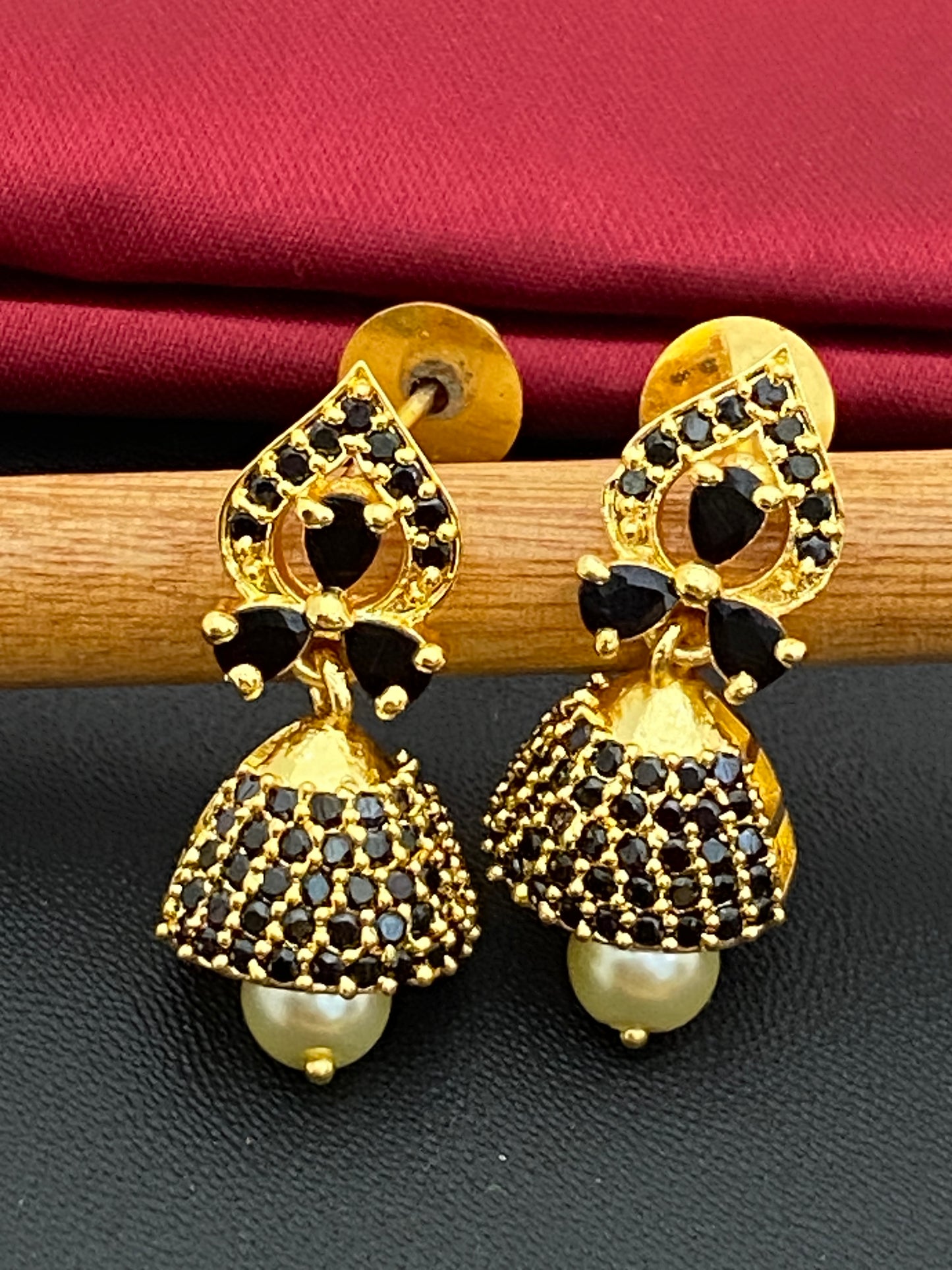 Gorgeous Black Color Stoned Gold Plated Jhumka Earrings