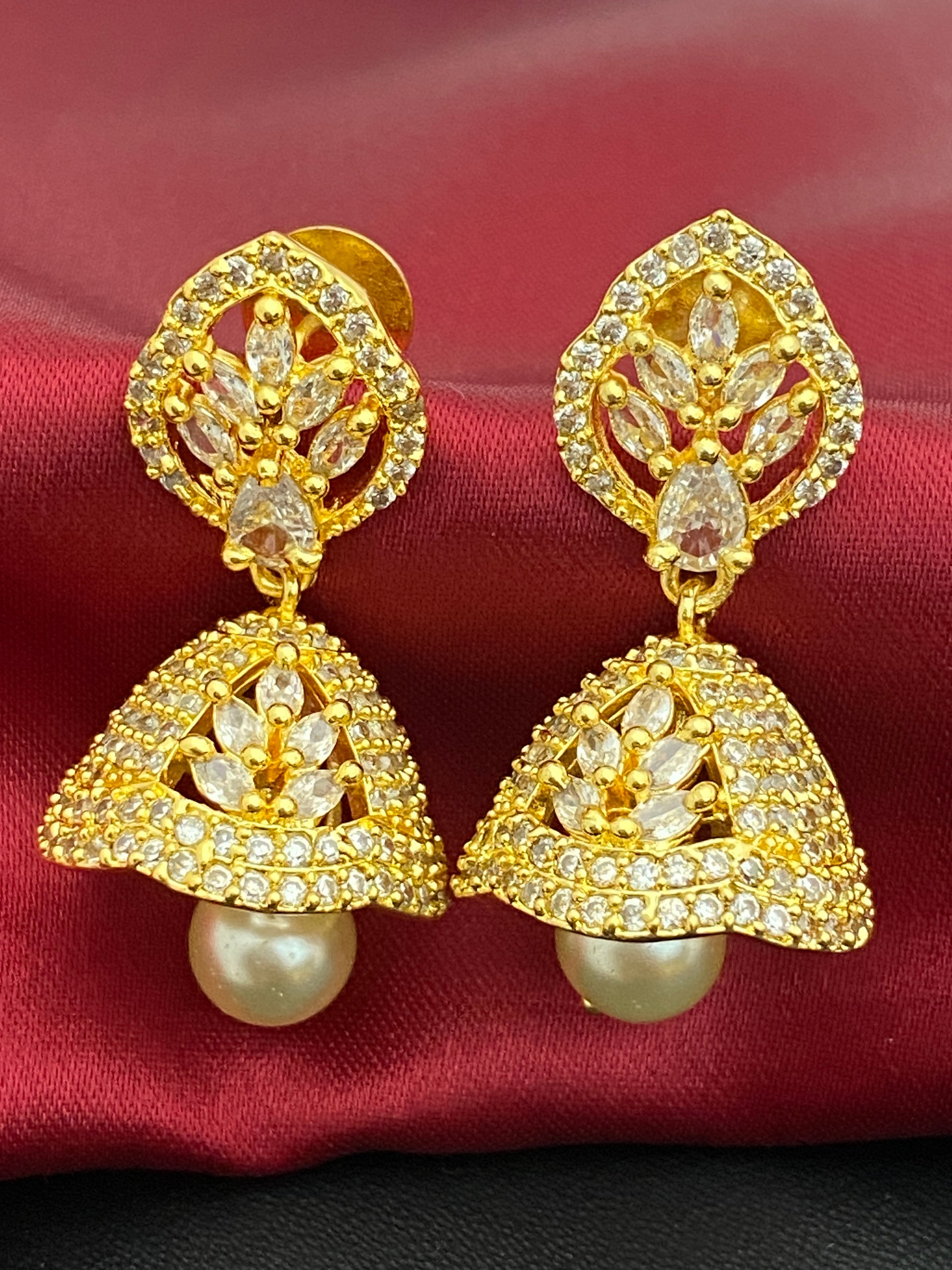 Charming Gold Plated White Color Jhumka Earrings With CZ Stones