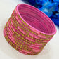 Alluring Rani Pink Color Stone Work Glass Bangles For Women