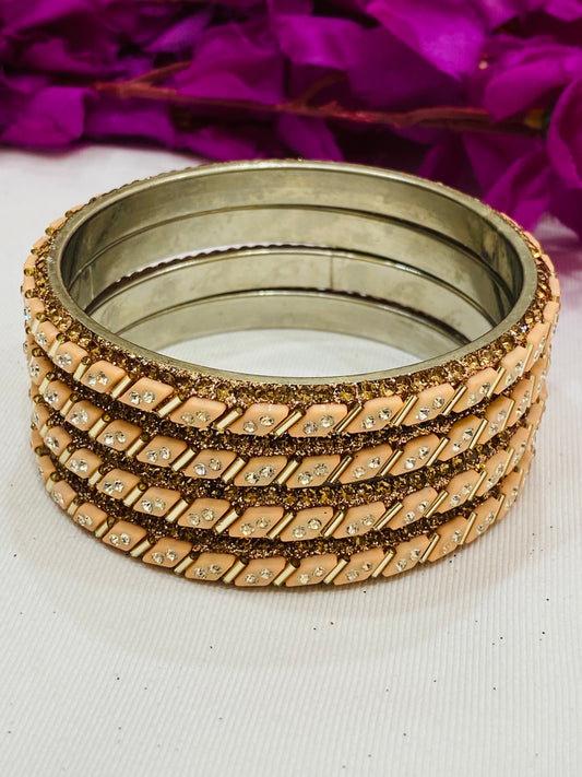 Appealing Peach Color Metal Bangles With Glitter Stone Work For Women