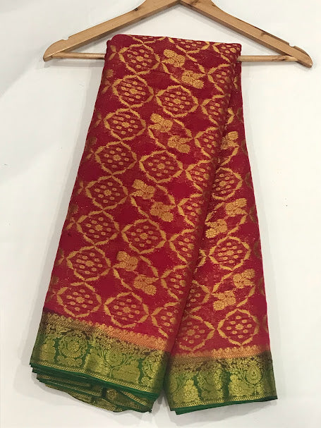 Appealing Maroon Color Georgette Saree With Gold Printed Work For Women